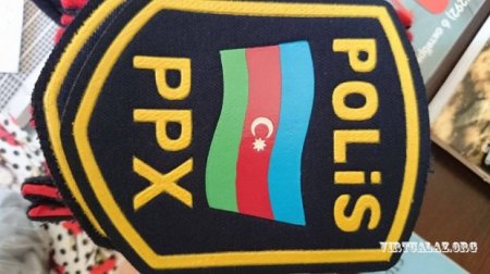 Cinayətkarlar polis zabiti geyimində